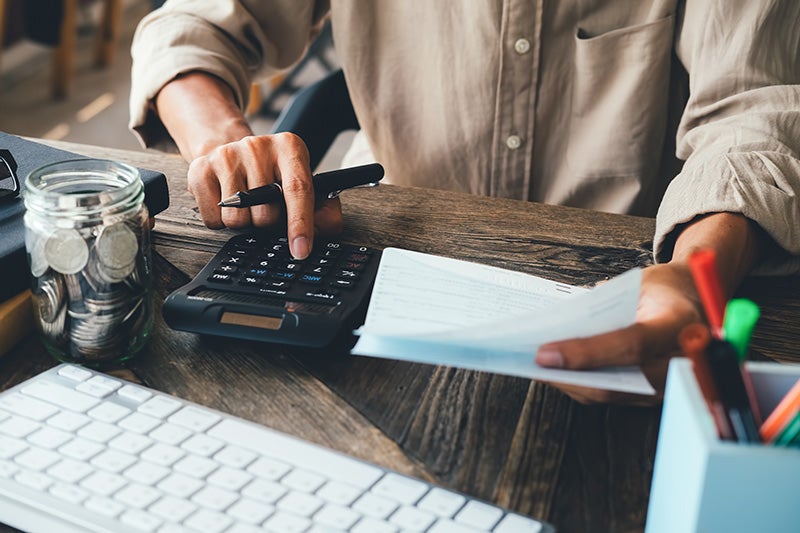 Person calculating finances